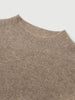 Close-up of a brown ribbed knit sweater collar on a light gray background