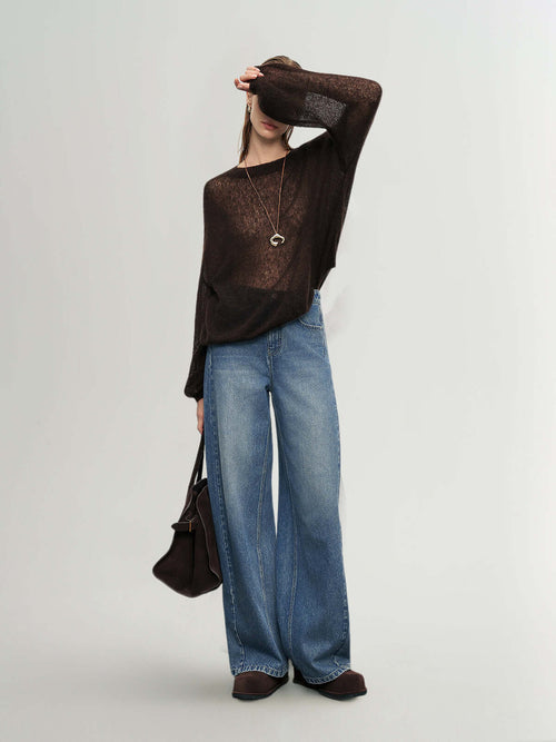 Load image 1 in gallery view. Model wearing a Cashmere-Silk Relaxed Pullover Sweater with wide-leg jeans for a stylish look.