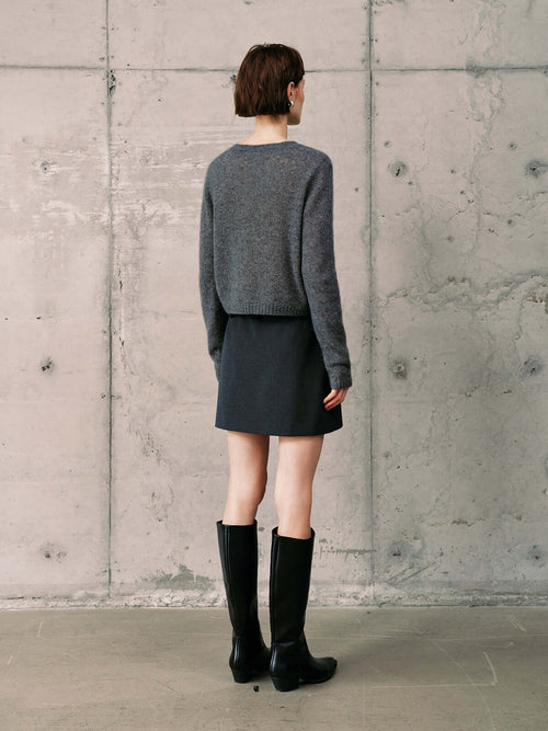 Load image 1 in gallery view. Silk-Cashmere Cardigan worn with a skirt and knee-high boots, showcasing a stylish, neutral outfit.