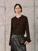 Silk-Cashmere Cardigan worn with a pleated skirt, showcasing its soft texture and versatile style.
