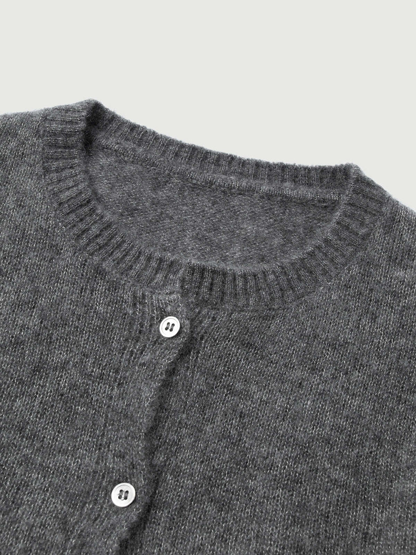 Silk-Cashmere Cardigan with a textured gray knit and button details, perfect for layering in tropical climates.