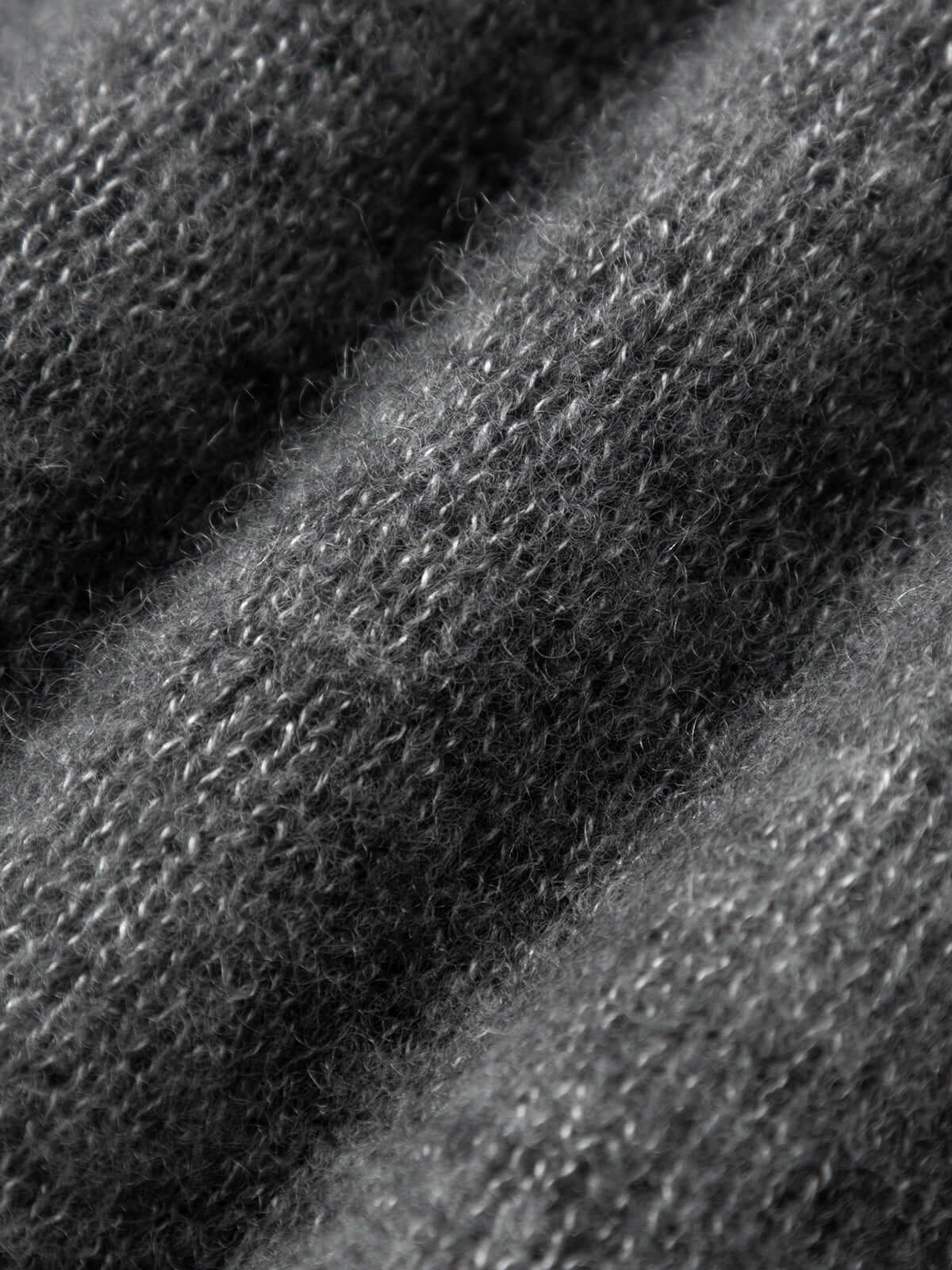 Close-up of the soft texture of a Silk-Cashmere Cardigan showcasing cozy fibers.