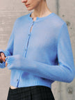 Silk-Cashmere Cardigan in soft blue color, showcasing lightweight and cozy design perfect for tropical climates.