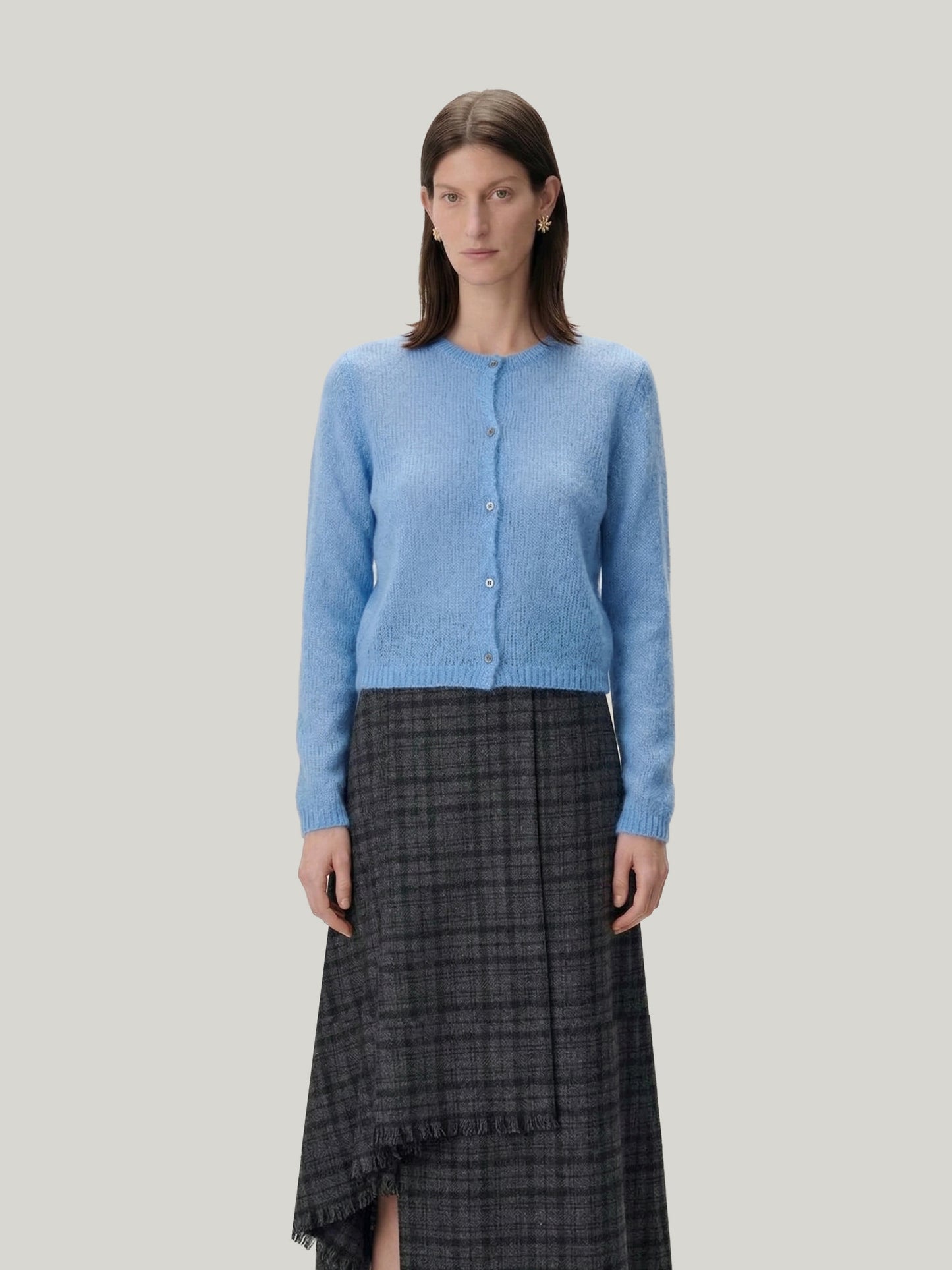 Model wearing a Silk-Cashmere Cardigan with a long skirt and black boots, showcasing versatile styling options.