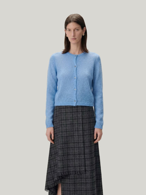 Load image 1 in gallery view. Model wearing a Silk-Cashmere Cardigan with a long skirt and black boots, showcasing versatile styling options.