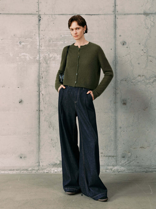 Load image 1 in gallery view. Silk-Cashmere Cardigan styled with wide-leg jeans in a modern, minimalistic setting.