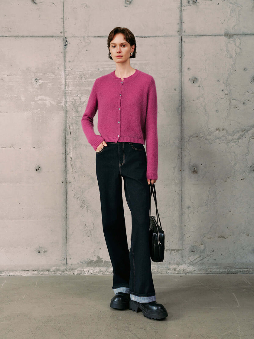 Silk-Cashmere Cardigan in pink worn with black jeans for a stylish look.