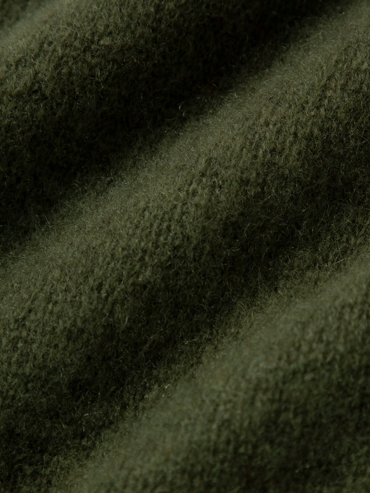Silk-Cashmere Cardigan fabric detail showcasing soft texture in muted green, perfect for layering and comfort.
