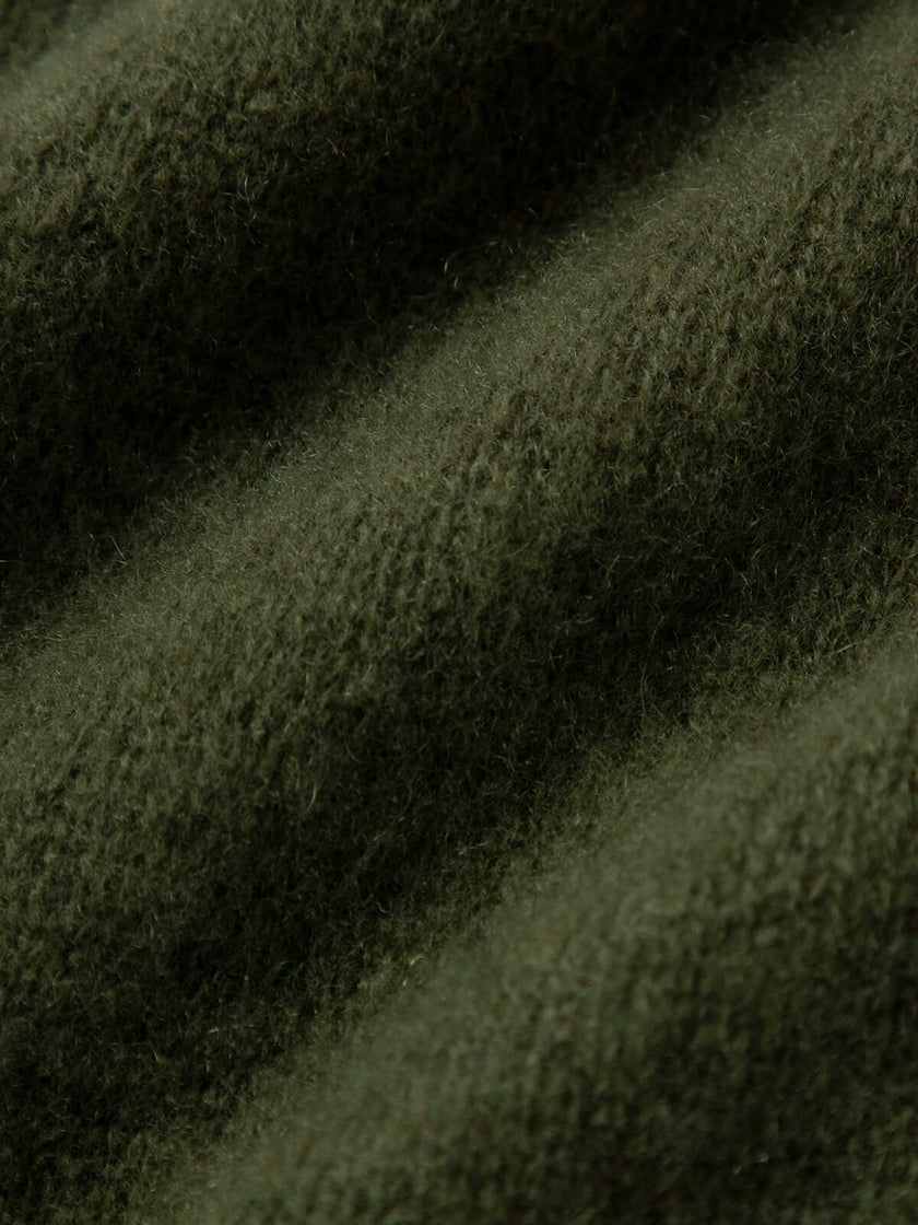 Silk-Cashmere Cardigan fabric detail showcasing soft texture in muted green, perfect for layering and comfort.