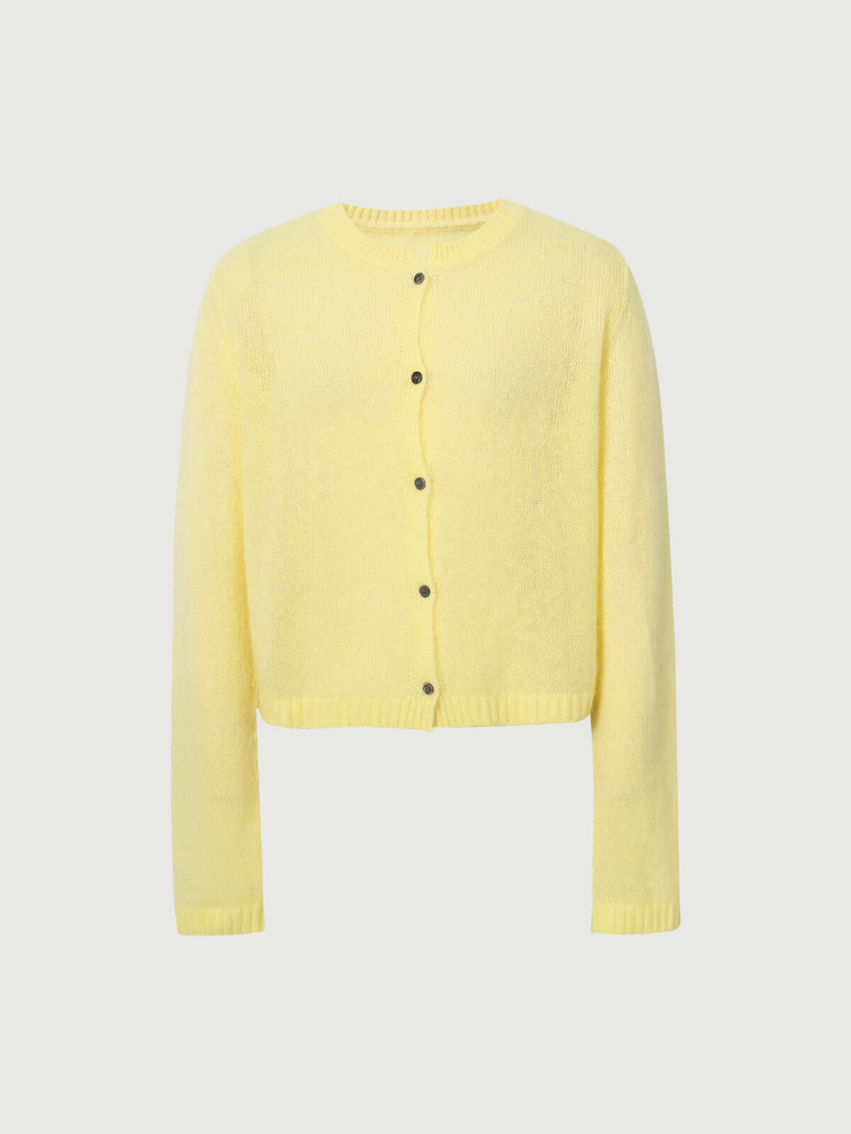 Silk-Cashmere Cardigan in soft yellow, featuring a button-down front and long sleeves, perfect for layering.