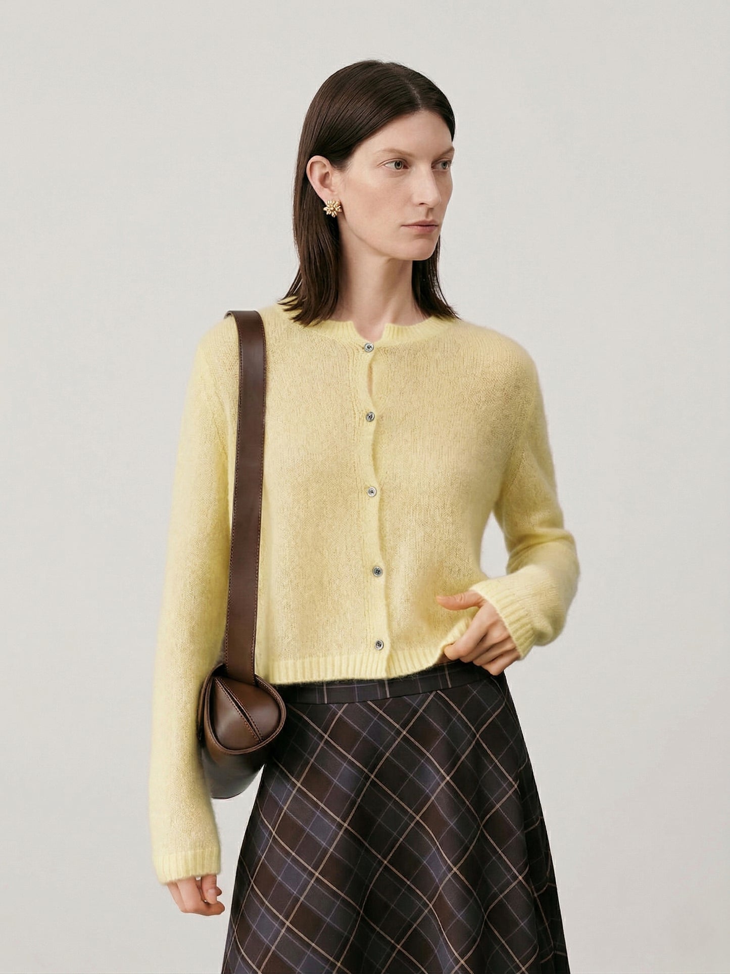 Silk-Cashmere Cardigan in soft yellow, featuring a button-up design and cozy fit, perfect for layering.