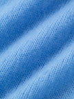 Close-up of soft blue fabric texture for a Silk-Cashmere Cardigan.