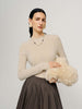 Woman wearing beige cashmere