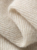 Close-up of beige knitted fabric